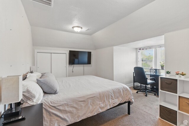 775 E Simpson Ave, Salt Lake City, UT 84106 - bedroom featuring visible vents, lofted ceiling, and light carpet