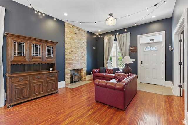 775 E Simpson Ave, Salt Lake City, UT 84106 - living room with recessed lighting, baseboards, wood finished floors, and a fireplace