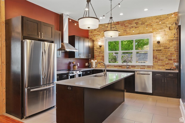 775 E Simpson Ave, Salt Lake City, UT 84106 - kitchen with hanging light fixtures, a sink, light countertops, stainless steel appliances, and wall chimney exhaust hood