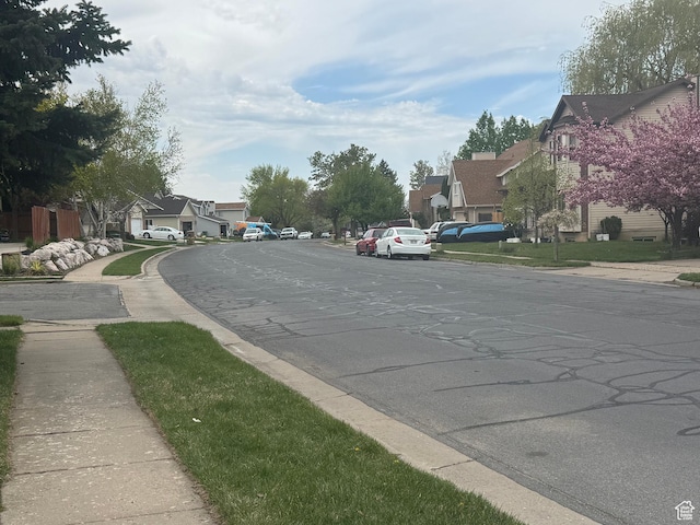 1952 E Sunset Dr, Layton, UT 84040 - view of road featuring a residential view, sidewalks, and curbs