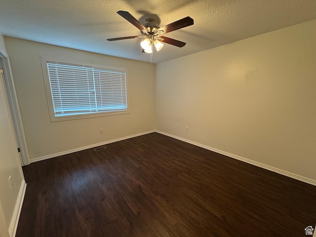 1952 E Sunset Dr, Layton, UT 84040 - unfurnished room featuring baseboards, a ceiling fan, dark wood finished floors, and a textured ceiling