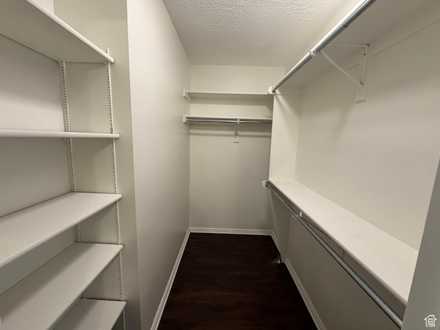 1952 E Sunset Dr, Layton, UT 84040 - walk in closet with dark wood-type flooring