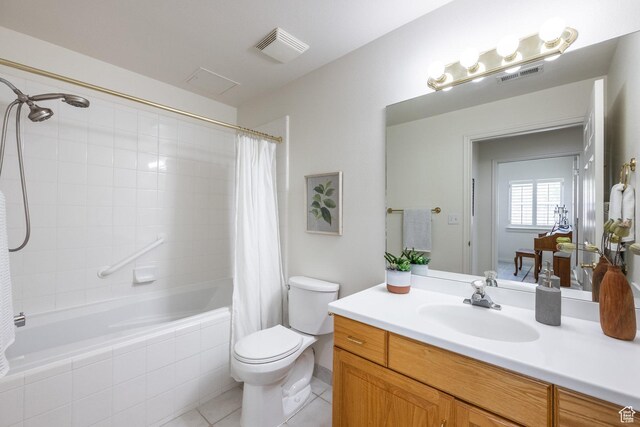 11035 S Grape Vine Cv Unit 106, Sandy, UT 84070 - bathroom with visible vents, tile patterned flooring, tiled shower / bath combo, and toilet