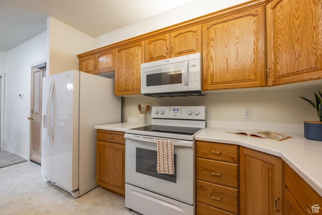 11035 S Grape Vine Cv Unit 106, Sandy, UT 84070 - kitchen with brown cabinets and white appliances
