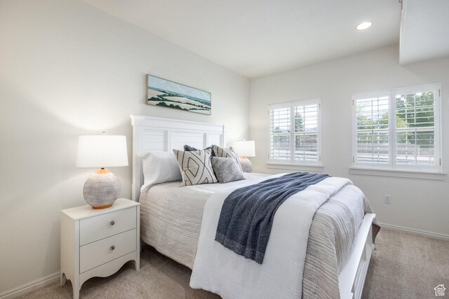 11035 S Grape Vine Cv Unit 106, Sandy, UT 84070 - bedroom with recessed lighting, baseboards, and light colored carpet