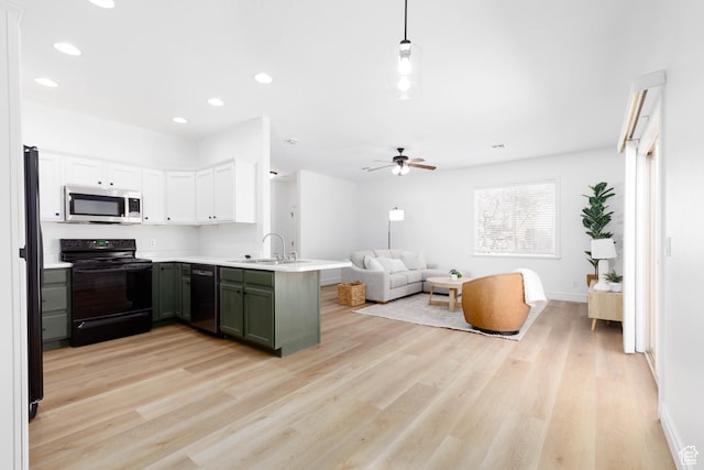525 N 2480 W, Hurricane, UT 84737 - kitchen with a peninsula, light wood-style floors, open floor plan, recessed lighting, and black appliances