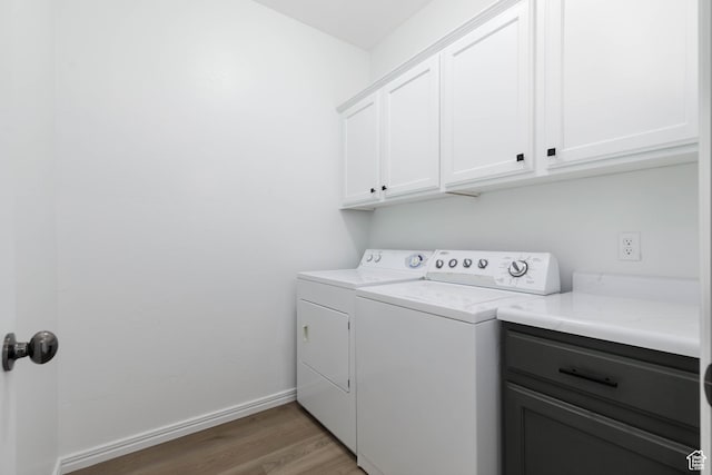 525 N 2480 W, Hurricane, UT 84737 - laundry area with baseboards, washer and clothes dryer, cabinet space, and light wood finished floors