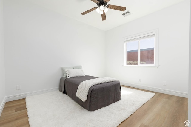 525 N 2480 W, Hurricane, UT 84737 - bedroom with visible vents, light wood-style flooring, ceiling fan, and baseboards