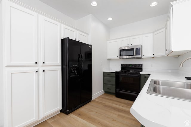 525 N 2480 W, Hurricane, UT 84737 - kitchen featuring light wood-type flooring, a sink, light countertops, black appliances, and white cabinetry