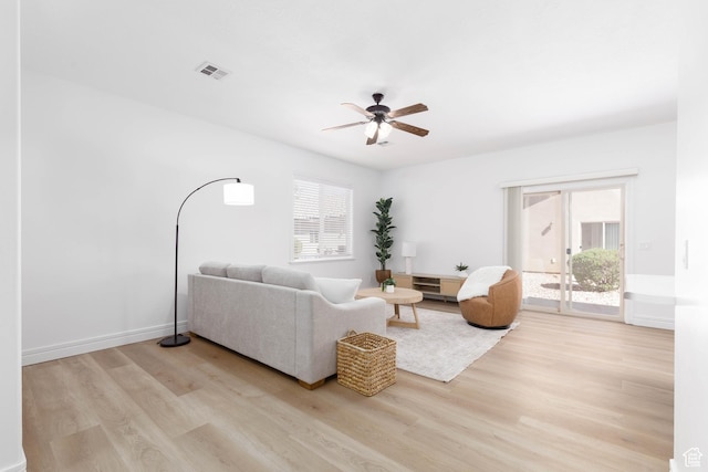 525 N 2480 W, Hurricane, UT 84737 - living room with ceiling fan, visible vents, baseboards, and light wood-type flooring