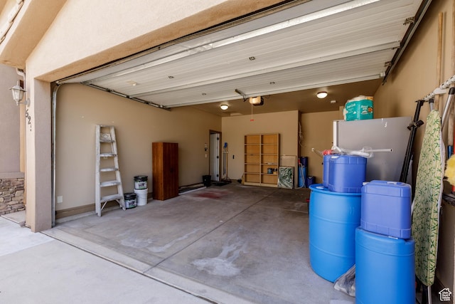525 N 2480 W, Hurricane, UT 84737 - garage with refrigerator and a garage door opener