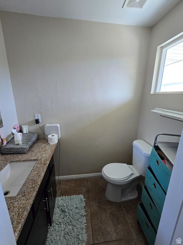 3505 W San Marcos Cir, West Valley City, UT 84119 - bathroom featuring vanity, toilet, tile patterned floors, baseboards, and visible vents
