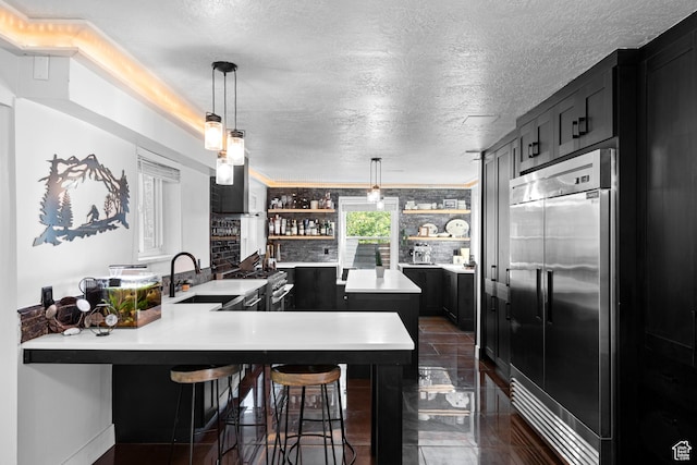 11622 S Worthington Ct E, Sandy, UT 84092 - kitchen featuring a sink, high quality appliances, open shelves, light countertops, and dark cabinets