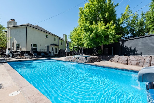 11622 S Worthington Ct E, Sandy, UT 84092 - view of swimming pool with a water slide and a patio area