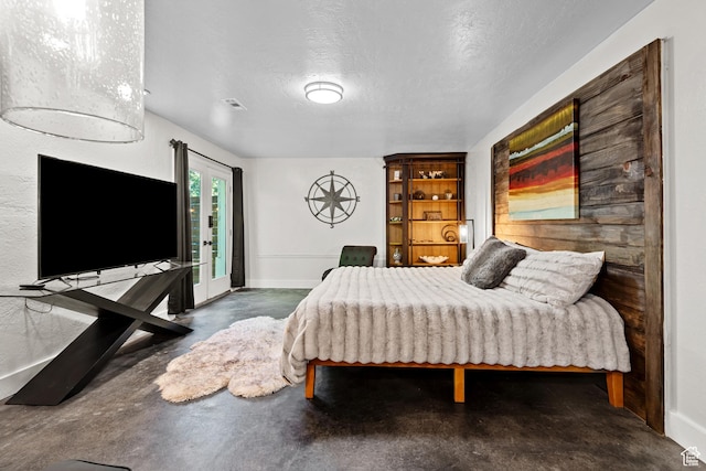 11622 S Worthington Ct E, Sandy, UT 84092 - bedroom featuring concrete flooring, baseboards, and a textured ceiling