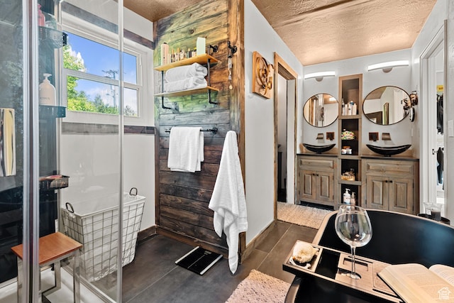 11622 S Worthington Ct E, Sandy, UT 84092 - full bath featuring a textured ceiling, double vanity, wood finished floors, and baseboards