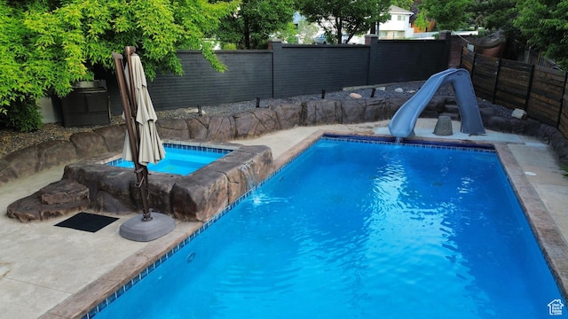 11622 S Worthington Ct E, Sandy, UT 84092 - view of pool with a water slide and a fenced backyard