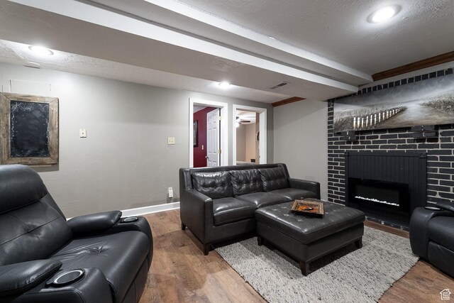 11622 S Worthington Ct E, Sandy, UT 84092 - living room featuring wood finished floors, baseboards, and a fireplace
