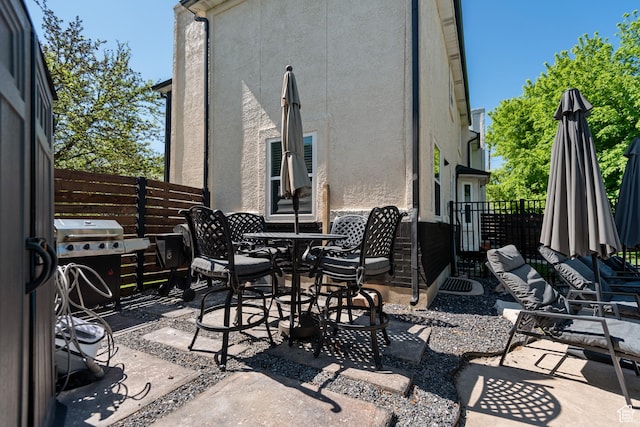 11622 S Worthington Ct E, Sandy, UT 84092 - view of patio featuring outdoor dining space and a grill