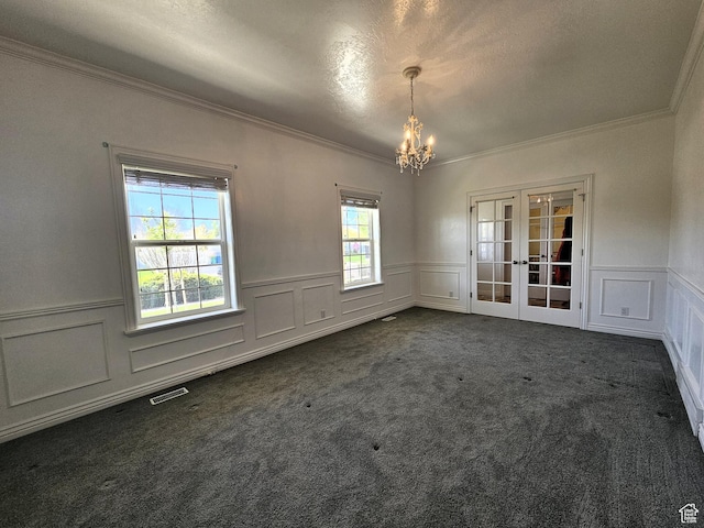 598 W 1620 S, Lehi, UT 84043 - spare room with crown molding, french doors, a chandelier, a decorative wall, and dark colored carpet