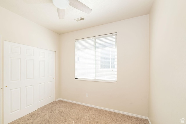 6709 S Empress Ln W, West Jordan, UT 84081 - unfurnished bedroom featuring visible vents, carpet flooring, baseboards, and ceiling fan