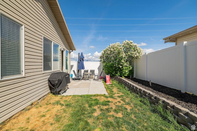 6709 S Empress Ln W, West Jordan, UT 84081 - view of yard with a fenced backyard and a patio