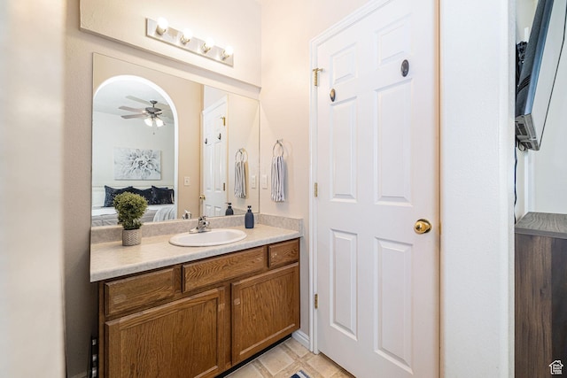 6709 S Empress Ln W, West Jordan, UT 84081 - bathroom featuring a ceiling fan, ensuite bathroom, and vanity