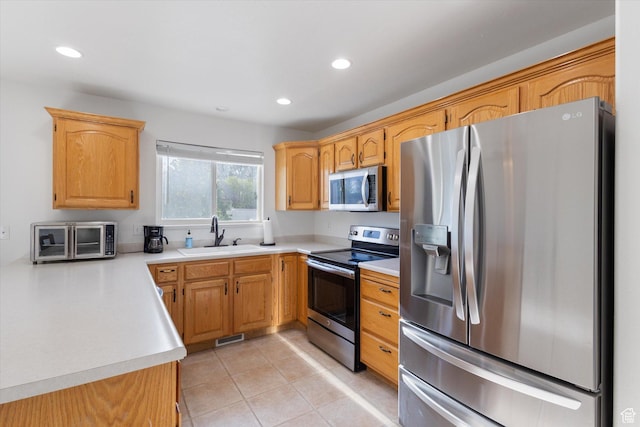 1295 N 190 E, Lehi, UT 84043 - kitchen with a sink, light countertops, a toaster, stainless steel appliances, and recessed lighting
