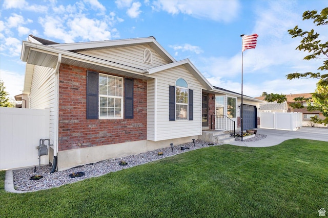 1295 N 190 E, Lehi, UT 84043 - ranch-style home featuring a front lawn, fence, brick siding, an attached garage, and driveway