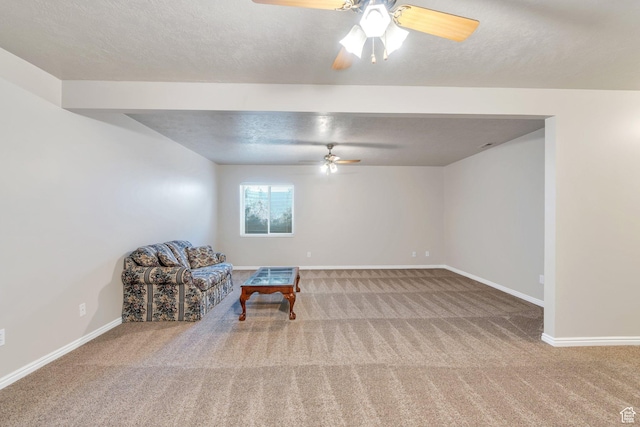597 E Villager Ln, Midvale, UT 84047 - sitting room featuring baseboards, a textured ceiling, carpet, and ceiling fan