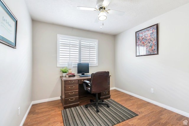 597 E Villager Ln, Midvale, UT 84047 - office featuring baseboards, a ceiling fan, and wood finished floors