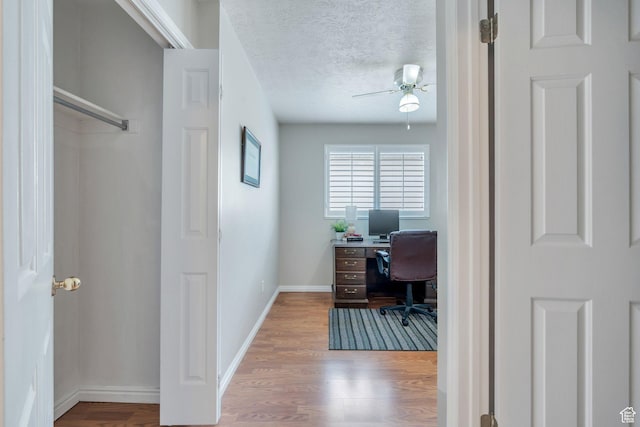 597 E Villager Ln, Midvale, UT 84047 - office space featuring a textured ceiling, baseboards, ceiling fan, and wood finished floors