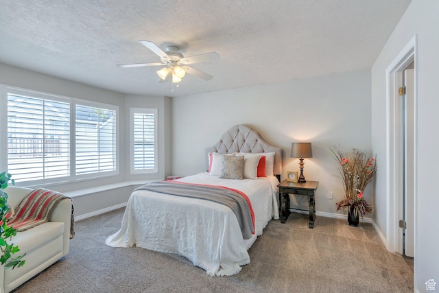 597 E Villager Ln, Midvale, UT 84047 - carpeted bedroom with a textured ceiling, baseboards, and a ceiling fan