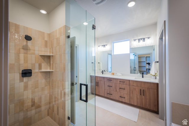 8093 S 615 E, Sandy, UT 84070 - full bath with double vanity, tile patterned flooring, a shower stall, and a sink