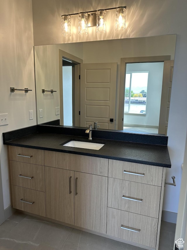 8093 S 615 E, Sandy, UT 84070 - bathroom featuring vanity, baseboards, and tile patterned floors