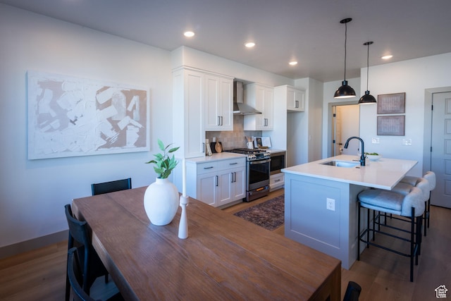 8093 S 615 E, Sandy, UT 84070 - kitchen with a sink, stainless steel gas range oven, wall chimney range hood, and dark wood-style floors