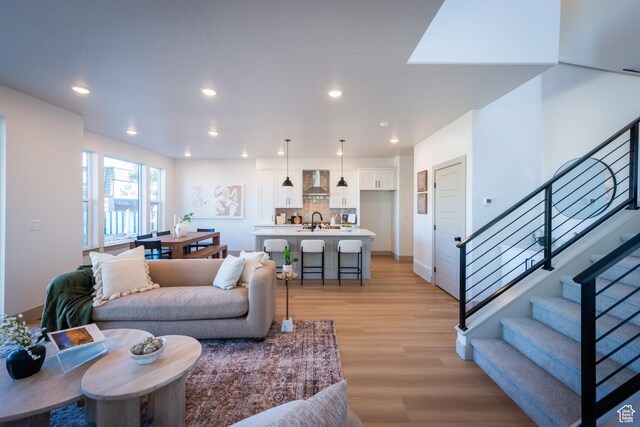 8093 S 615 E, Sandy, UT 84070 - living area featuring recessed lighting, baseboards, light wood-style flooring, and stairway