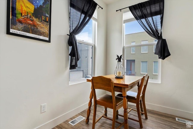 6216 W Birch Run Rd S, South Jordan, UT 84009 - dining area with baseboards, wood finished floors, and visible vents