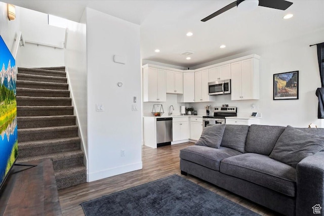 6216 W Birch Run Rd S, South Jordan, UT 84009 - living area featuring stairs, baseboards, ceiling fan, dark wood-style floors, and recessed lighting