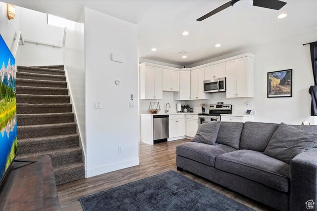 6216 W Birch Run Rd S, South Jordan, UT 84009 - living area featuring stairs, baseboards, ceiling fan, dark wood-style floors, and recessed lighting