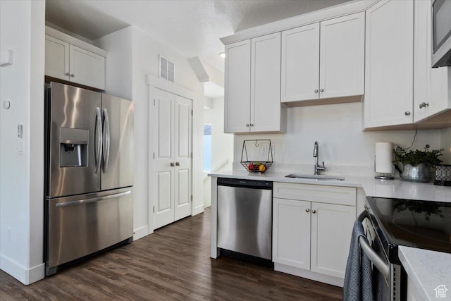 6216 W Birch Run Rd S, South Jordan, UT 84009 - kitchen with visible vents, a sink, appliances with stainless steel finishes, and dark wood-type flooring