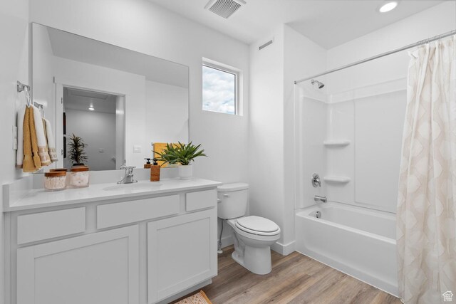 1302 N 375 E Unit 140, Harrisville, UT 84404 - full bathroom featuring wood finished floors, toilet, vanity, and shower / bath combination with curtain