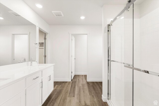 3461 S 3100 W Unit 175, West Haven, UT 84401 - bathroom with a shower stall, wood finished floors, double vanity, recessed lighting, and baseboards