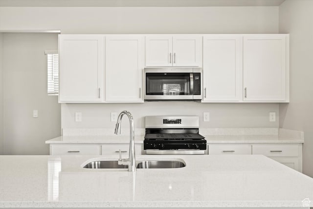 3461 S 3100 W Unit 175, West Haven, UT 84401 - kitchen featuring stainless steel appliances, white cabinetry, a sink, and light stone countertops