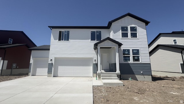 3461 S 3100 W Unit 175, West Haven, UT 84401 - view of front of home featuring board and batten siding, concrete driveway, and a garage