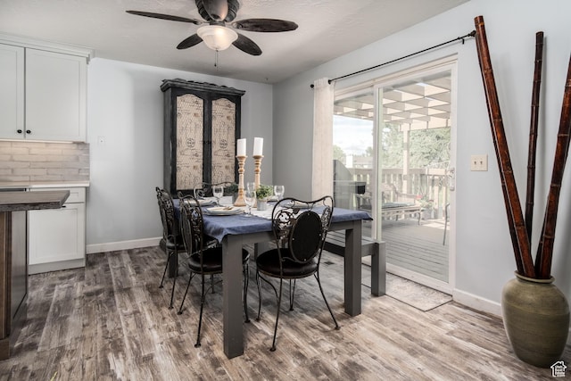 9745 S Tayside Dr W, South Jordan, UT 84009 - dining area featuring wood finished floors, a ceiling fan, and baseboards