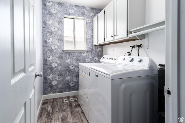 9745 S Tayside Dr W, South Jordan, UT 84009 - laundry room with washing machine and dryer, wallpapered walls, baseboards, dark wood finished floors, and cabinet space