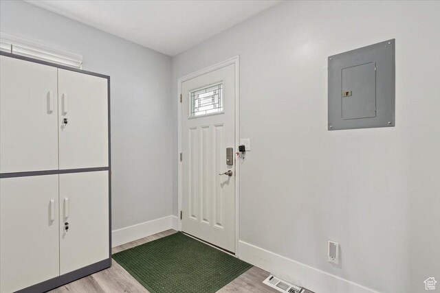 4612 S 600 E, Murray, UT 84107 - entryway featuring baseboards, visible vents, light wood finished floors, and electric panel