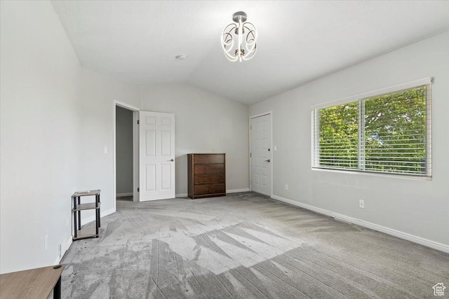 4612 S 600 E, Murray, UT 84107 - unfurnished room featuring baseboards, a notable chandelier, vaulted ceiling, and light carpet