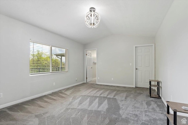 4612 S 600 E, Murray, UT 84107 - unfurnished bedroom featuring carpet floors, baseboards, lofted ceiling, and a notable chandelier